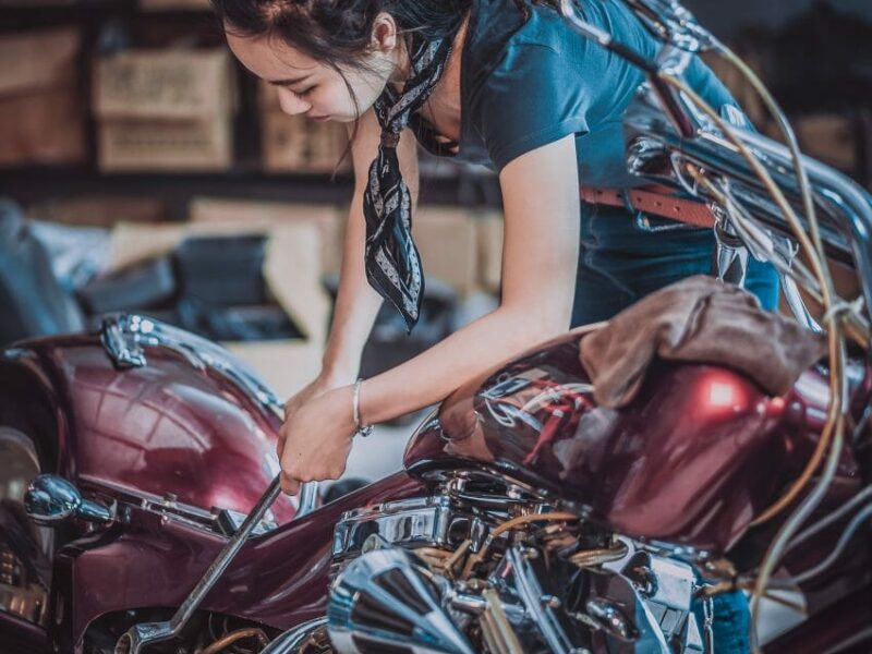 woman adjusting motorcycle reasonable adjustment equalities act 2010 diversity inclusion AbilityNet